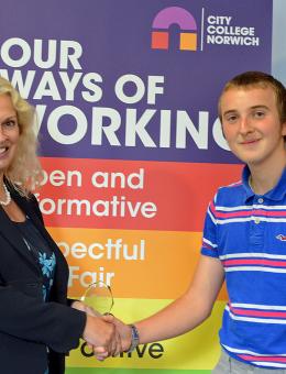 Callum Ellis is congratulated by City College Norwich principal Corinne Peasgood
